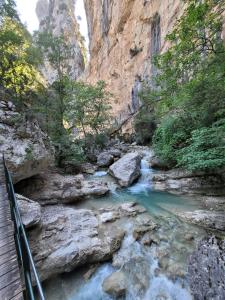 a bridge over a river in a canyon at Chambres "Chez ELLE" in Oraison