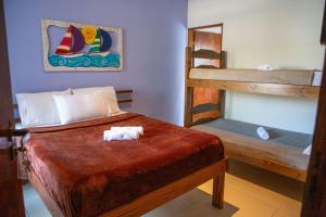 a bedroom with two bunk beds in a room at Pousada Quintal do Mar in Ubatuba +121 photos