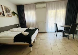 Postel nebo postele na pokoji v ubytování B&B Maya