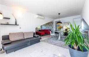 a living room with a couch and a table at Apartment Krilo Jesenice 24 in Jesenice