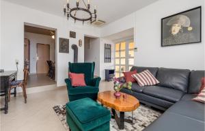 a living room with a couch and chairs and a table at Beautiful Home In Banjol With Sauna in Banjol