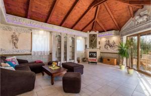 a living room with a couch and a table at Gorgeous Home In Zgaljici With Sauna in Žgaljić