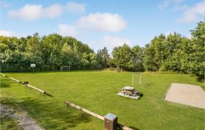 a large grassy field with a soccer goal at Two-Bedroom Holiday Home In Logstor in Løgsted