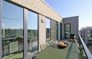 a balcony with a table with a bowl of fruit on it at Penthouse Comfort in Lembruch
