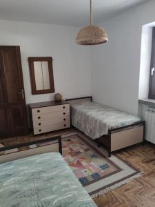 Postel nebo postele na pokoji v ubytování Appartamento Cogno + 9 fotografií