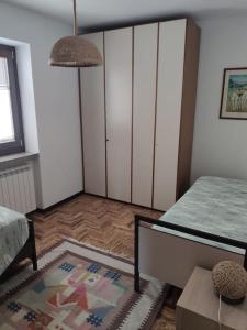Postel nebo postele na pokoji v ubytování Appartamento Cogno