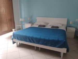 A bed or beds in a room at Appartamento La Bonifica