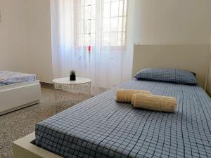 a bedroom with a bed with a pillow on it at Villa Vento del Sud in Villa Castelli