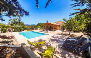 a swimming pool with chairs and a house at Beautiful Home In Prades-Sur-Vernazobre in Prades-sur-Vernazobre +16 photos