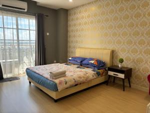 Postel nebo postele na pokoji v ubytování KF Homestay Premium Suite + 5 fotografií