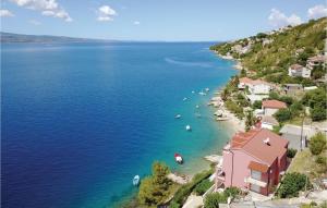 an aerial view of a beach with boats in the water at One-Bedroom Apartment In Stanici in Celina