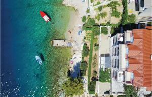 an overhead view of a beach with two boats in the water at One-Bedroom Apartment In Stanici in Celina