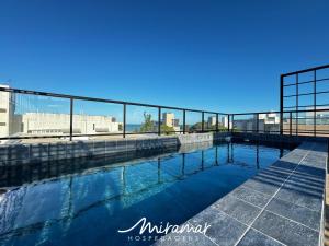 a swimming pool with a view of the city at Flat No Bessa com Varanda Gourmet in João Pessoa