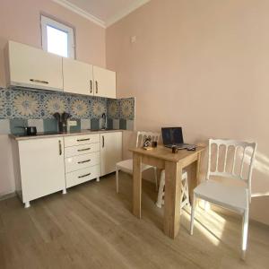 Kuchyň nebo kuchyňský kout v ubytování Guest House Deme