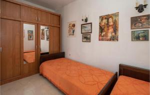 Postel nebo postele na pokoji v ubytování Holiday Home Podgora 14