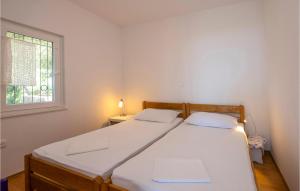 Postel nebo postele na pokoji v ubytování Holiday Home Podgora 14