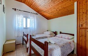 Postel nebo postele na pokoji v ubytování Holiday Home Pelegrin 58