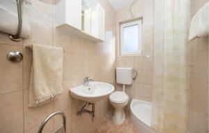 Kúpeľňa v ubytovaní Apartment Vojskovo Iii