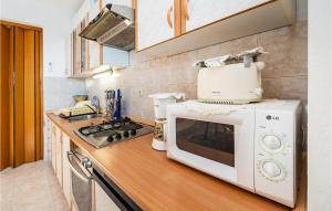 Kuchyň nebo kuchyňský kout v ubytování Apartment In Zadar