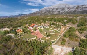 an aerial view of a house in the mountains at Four-Bedroom Holiday Home In Kijevo in Kijevo +42 photos