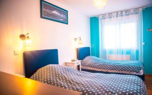 Postel nebo postele na pokoji v ubytování Maison Malo Plage
