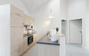 a kitchen with white walls and a counter with a appliance at Amazing Home In Krems Iiwarderbrück in Göls