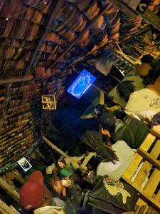 een groep mensen die op de vloer van een kamer liggen bij Aroma Home - Eco-Cabins on a Coffee Farm in Arusha