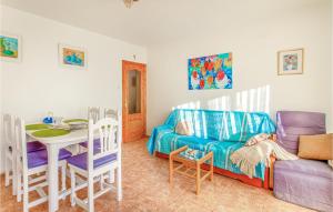 a living room with a couch and a table at Awesome Apartment In Santa Pola in Santa Pola