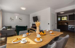 a dining room table with food on top of it at Nice Home In Stari Laz With Kitchen in Stari Laz