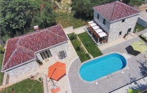 an overhead view of a house with a swimming pool at 4 Bedroom Lovely Home In Cilipi in Čilipi