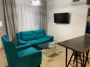 TV a/nebo společenská místnost v ubytování Knebl Apartman