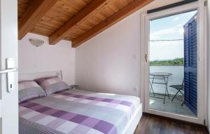 Postel nebo postele na pokoji v ubytování Holiday Home Cokuni Vi