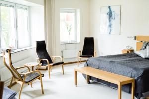 Postel nebo postele na pokoji v ubytování Nynäsgården Hotell & Konferens + 37 fotografií