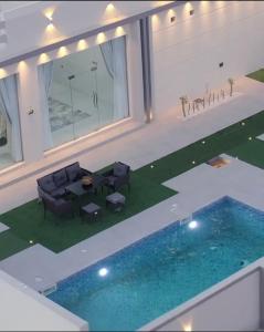an image of a house with a swimming pool at alsaif camp in Bidiyah