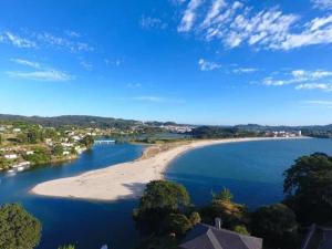 an aerial view of a beach in a body of water at Playa Centro Miño in Miño