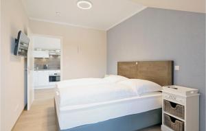 Postel nebo postele na pokoji v ubytování Baltischer Hof Apartment 63