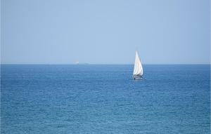 a small sail boat in the middle of the ocean at 4 Bedroom Stunning Home In Giarratana in Giarratana +21 photos
