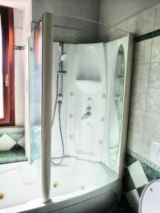 a bathroom with a shower and a bath tub at Ronf & Gnam GALIMBERTI in Turin +17 photos