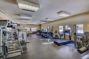 a gym with lots of treadmills and machines at Plaza 1409 by Summit County Mountain Retreats in Keystone