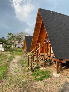 a row of houses with a black roof at Lago Cristal Chalets in Bucaramanga