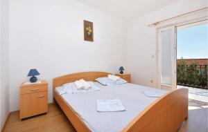 Posteľ alebo postele v izbe v ubytovaní Apartment Ivan Dolac With Sea View X