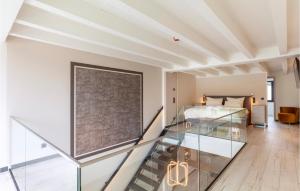 a glass staircase in a room with a bed at Prora Solitaire Avida Loft12 in Binz