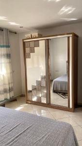a large mirror in a bedroom with a bed at Appartement City Agadir 2 in Agadir +22 photos