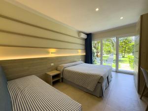 Postel nebo postele na pokoji v ubytování Hotel Villa Rodriguez