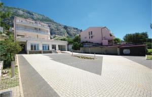 a large parking lot in front of some buildings at Apartment Vukovarska Iv in Makarska
