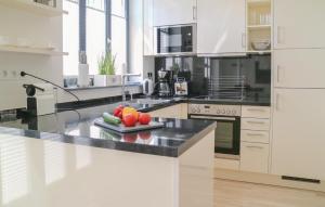 a kitchen with a counter with fruits and vegetables on it at Diamond in Binz
