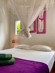 Ένα ή περισσότερα κρεβάτια σε δωμάτιο στο Villa Colada Résidence ARCADIA