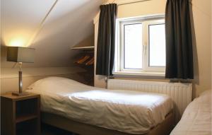 Een bed of bedden in een kamer bij Houtsnip