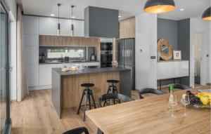 a kitchen and dining room with a table and chairs at 4 Bedroom Beautiful Home In Banjole in Banjole