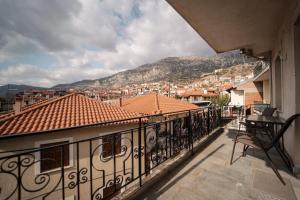 a balcony with a view of a city at Kokkovos Guesthouse Arachova in Arachova